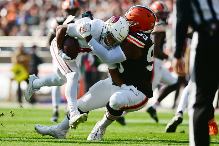 Nov 5, 2023; Cleveland, Ohio, USA; Cleveland Browns defensive tackle Shelby Harris (93) tackles Arizona Cardinals wide receiver Rondale Moore (4) during the first quarter at Cleveland Browns Stadium. Mandatory Credit: Ken Blaze-USA TODAY Sports